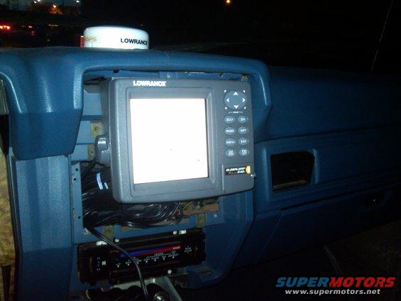 1986 Ford Bronco interior dashboard with Lowrance GPS unit and aftermarket stereo installed