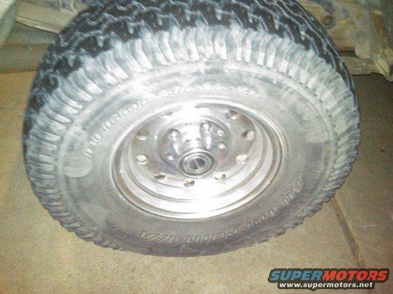 Tire and chrome wheel on a vehicle, close-up view