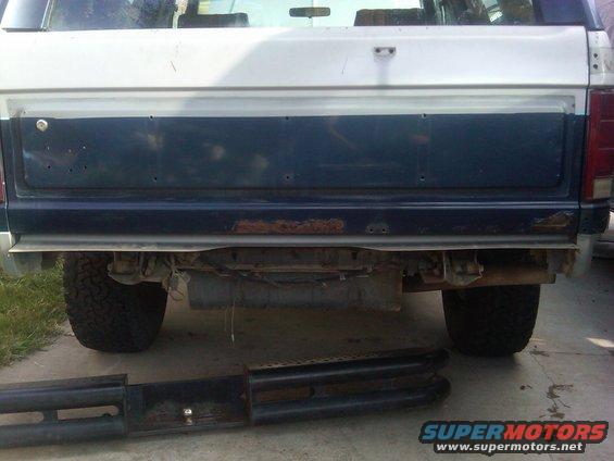 1986 Ford Bronco rear view, showing tailgate and bumper area. Side steps are removed and placed in front