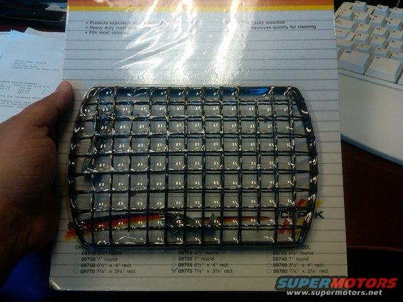 Black wire mesh grille part in packaging with product codes
