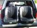 1986 Ford Bronco - Two J Beard racing seats are shown in the bed of a pickup truck.