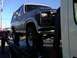 1986 Ford Bronco - This 1986 Ford Bronco is being loaded onto a tow truck.