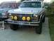 1986 Ford Bronco - Front view of a 1986 Ford Bronco, equipped with KC lights and a custom license plate.