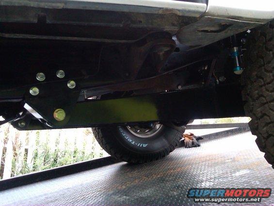 Undercarriage of a 1986 Ford Bronco showing suspension modifications and BFGoodrich All-Terrain tires