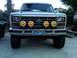 1986 Ford Bronco - This Ford Bronco from the early 1980s features custom smiley face auxiliary lights above the front bumper.