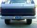 1986 Ford Bronco - Rear view of a 1986 Ford Bronco, showing its tailgate and chrome bumper.