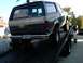 1986 Ford Bronco - This 1986 Ford Bronco, identified by its body style, is seen being loaded onto a tow truck. The number 990 is visible on the rear window.