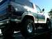 1986 Ford Bronco - This 1986 Ford Bronco is shown from a low angle, highlighting its large tires and two-tone paint scheme.
