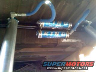 Two King Off-Road shocks mounted on a vehicle's undercarriage