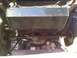 1986 Ford Bronco - Undercarriage view reveals an auxiliary fuel tank installation above the rear axle and leaf springs.