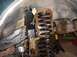 1992 Ford Bronco - Close-up of suspension components, likely during a repair or upgrade process.