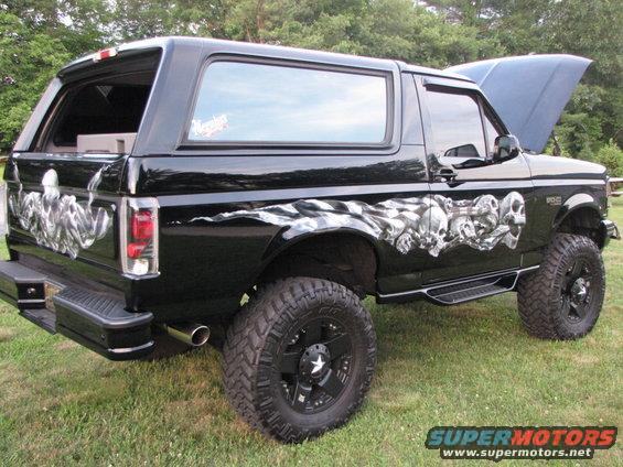 Black Ford Bronco with skull graphics and lifted suspension