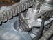 1992 Ford Bronco - Close-up view of internal transfer case components, including a chain and gears.