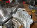 1992 Ford Bronco - A damaged transmission part is shown in detail, with gears and metal components visible.