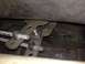 1973 Ford Torino - A close-up view of the mechanical linkage system, showing threaded rods and metal brackets.