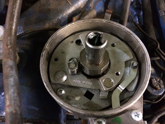 Distributor cap interior with rotor and "MADE IN USA" text