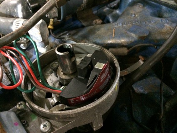 Mallory E-Spark ignition system with red and black housing, wires connected to distributor cap