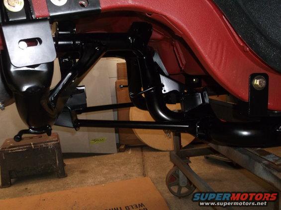 dscf11421.jpg This is the final mock-up fitting for the IRS cradle, it has been blasted, ground smooth, primed & painted. The rear mounts are now bolted in & the access holes for the top coil-over mounting bolt are cut. Access panels will be bolted over the holes.