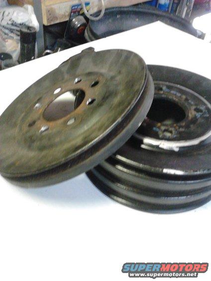 460-crank-pulley-015.jpg This pic shows where the original alternator pulley sheave was removed by drilling out spot welds, the silver marker shows where the 6-rib sheave would be welded.