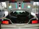 1997 Ford Crown Victoria - The rear of a white 1997 Ford Crown Victoria is shown with its trunk open, revealing its contents and modifications.