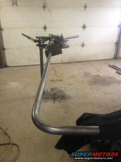 Tube bender with bent pipe