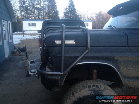 Rear view of black 1970 Ford F-250 with custom rack