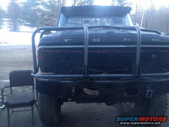 1970 Ford F-250 front end with a large metal bumper and grille