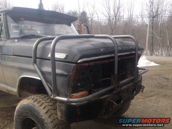 1970 Ford F-250 front view with custom brush guard and missing grille