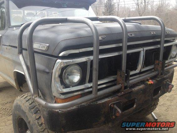 Front view of a 1970 Ford F-250 with a custom metal bumper and grille guard