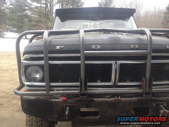 Black 1970 Ford F-250 front grille with chrome accents and a large metal bull bar