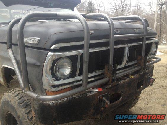 Front view of a 1970 Ford F-250 with a custom brush guard and aftermarket bumper