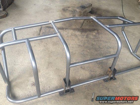 Welded steel tubing for a custom roll cage, possibly for an off-road vehicle