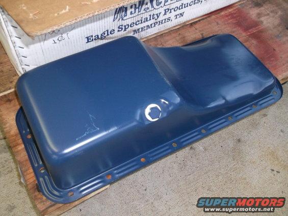 Blue oil pan with bolt holes and a circular opening