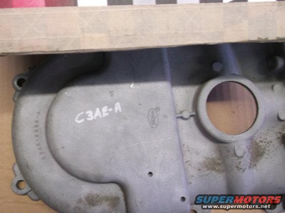 Close-up of a metal engine part with "C3AE-A" and a Ford logo stamped on it