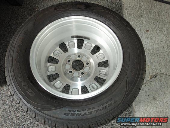 Goodyear Triple Tread All-Season tire mounted on a silver alloy wheel
