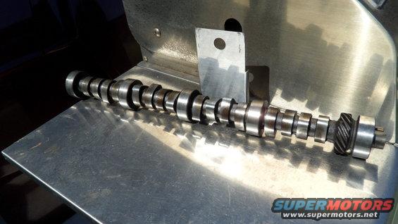 Camshaft with gear on a metal surface
