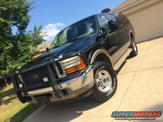 Black 2000 Ford Excursion front quarter view with chrome bull bar