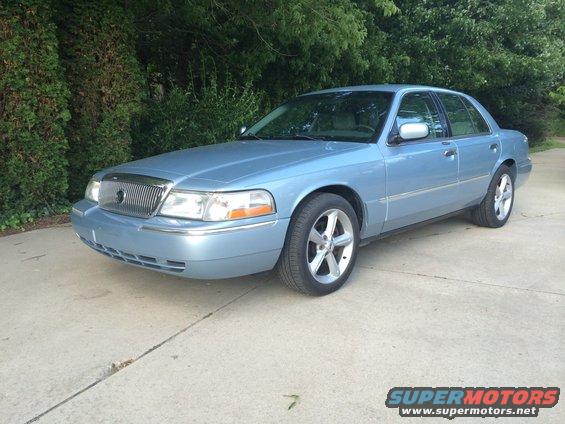 Blue 2003 Mercury Grand Marquis, 3/4 front view