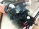 1988 Ford Bronco - A black power steering gearbox is shown up close with a PSC sticker and red capped fittings.