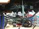 1988 Ford Bronco - The undercarriage of a vehicle is shown, focusing on the suspension components and frame.