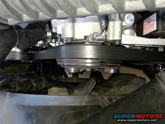 Close-up of a vehicle's engine belt and fan assembly