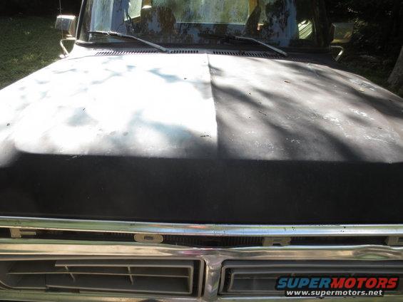 1978 Ford Bronco hood and grille, prepped for paint. Hood is split between primer and black paint