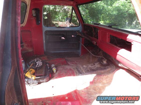 Red interior with tools on the floor