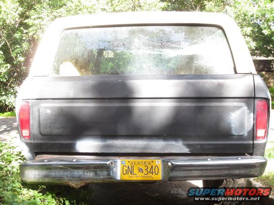 Rear view of a dark-colored Ford Bronco with an Alaska license plate