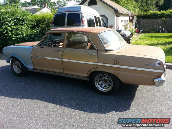 1963 Chevrolet Nova sedan with primer on front fender and rust on roof