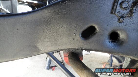 Black painted vehicle frame with stamped numbers '3 14 72' visible