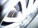 1993 Mazda MX-3 - Detail of a vehicle's wheel and brake rotor, showing the inner workings of the braking system.