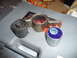 1993 Mazda MX-3 - Comparison of old and new suspension bushings, with one new bushing a blue polyurethane insert and visible part numbers.