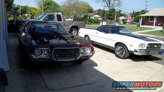 Maroon 1972 Ford Ranchero front view with hood open, white Ranchero beside it