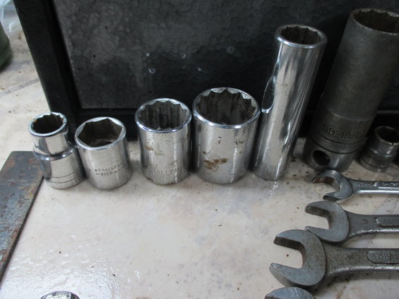 Socket set and wrenches on a surface